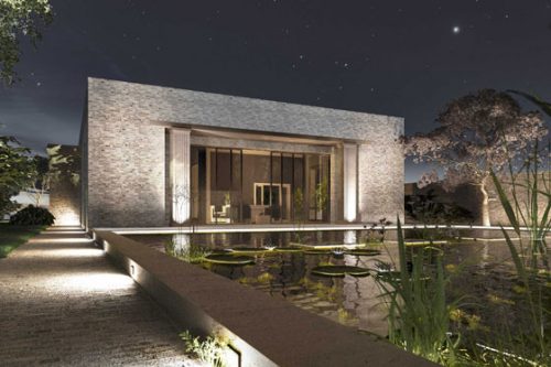 Der Hauskubus spiegelt sich nachts im riesigen Pool mit Seerosen.