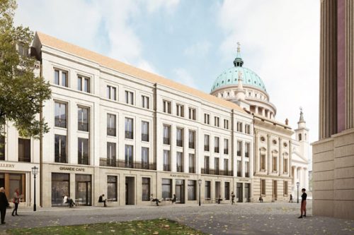 Die Risalite der langgestreckten Fassade nimmt man als benachbarte Stadthäuser wahr.